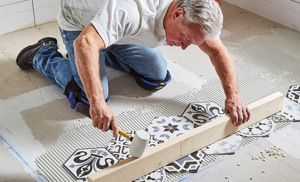 Encaustic tile installed in laundry room — full room coverage of ornate pattern