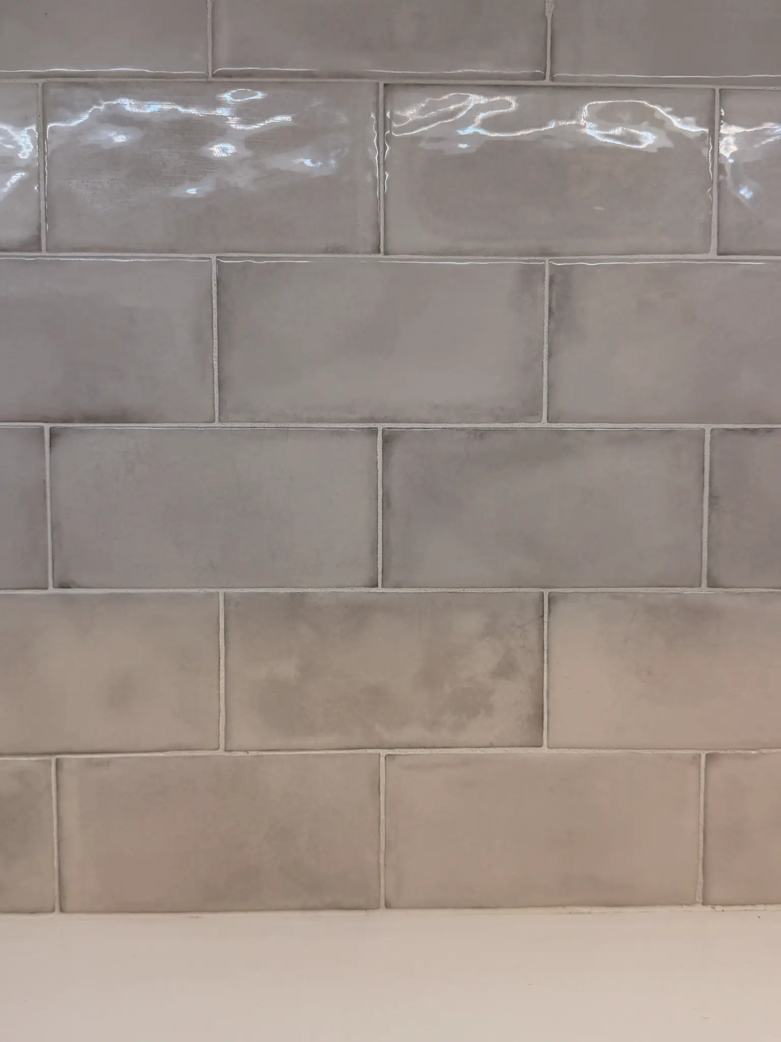 Gray subway tile kitchen backsplash — C & C Flooring Co. promotion
